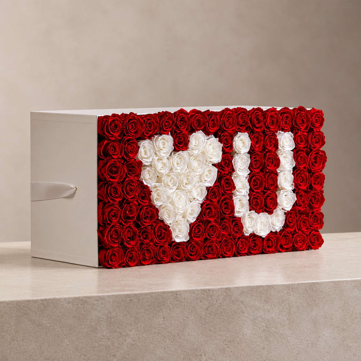Red and white roses forming a personalized-style floral gift display