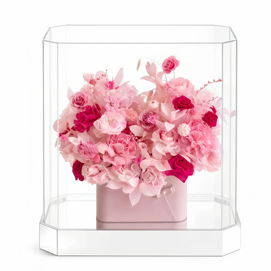 Blush-pink preserved flowers in a clear Parisian Bloom Garden box.