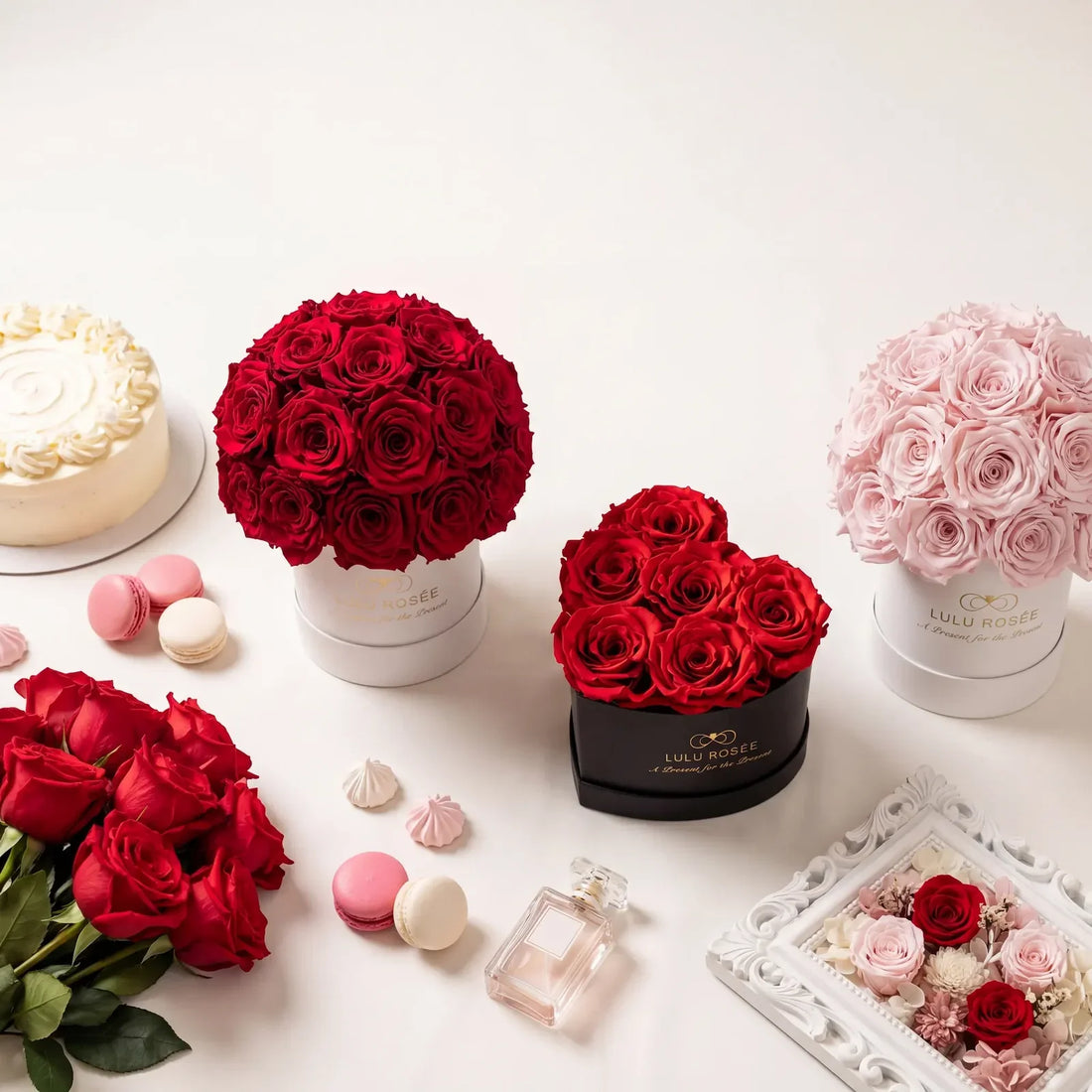 Several preserved rose boxes in different shapes and sizes displayed together.
