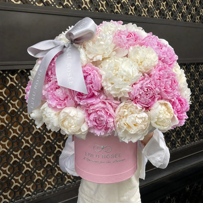 LULU ROSÉE Blush Peony Round Box with dual-tone cherry cream preserved peonies in an indoor studio setting