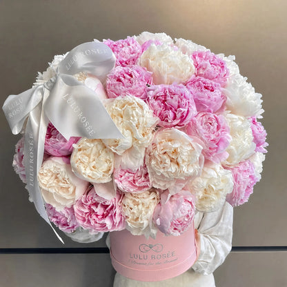 LULU ROSÉE Dual Tone Cherry Cream Peony Round Box, front‑facing studio gift box shot, preserved everlasting peony, long‑lasting for years, no maintenance required