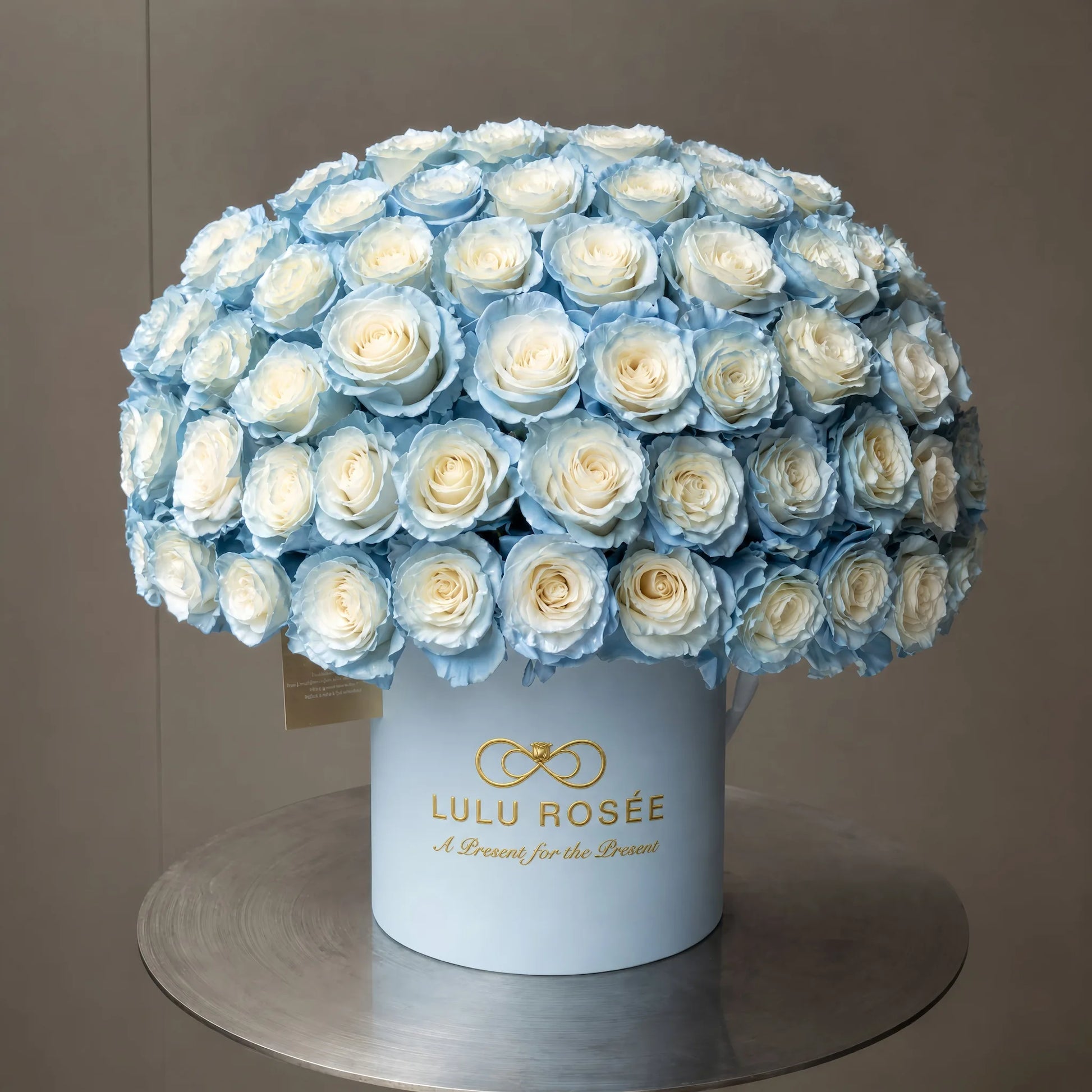 LULU ROSÉE Grande Superdome Ice Blue Gradient Preserved Rose Box, full dome of ice blue tipped everlasting roses in branded light blue cylinder flower box, luxury romantic floral gift