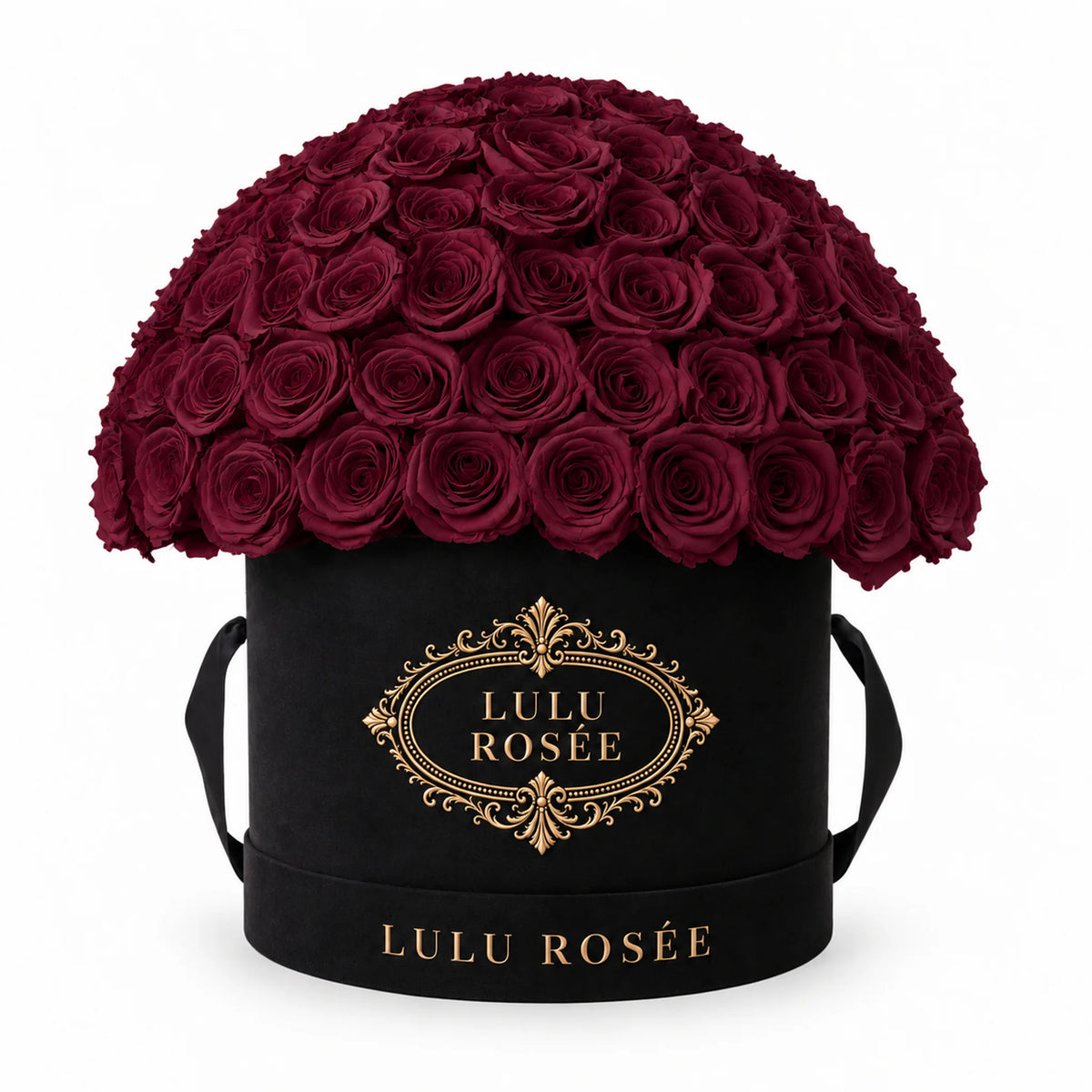 Burgundy preserved roses in a black LULU ROSÉE Large Le Plein box on a white background.