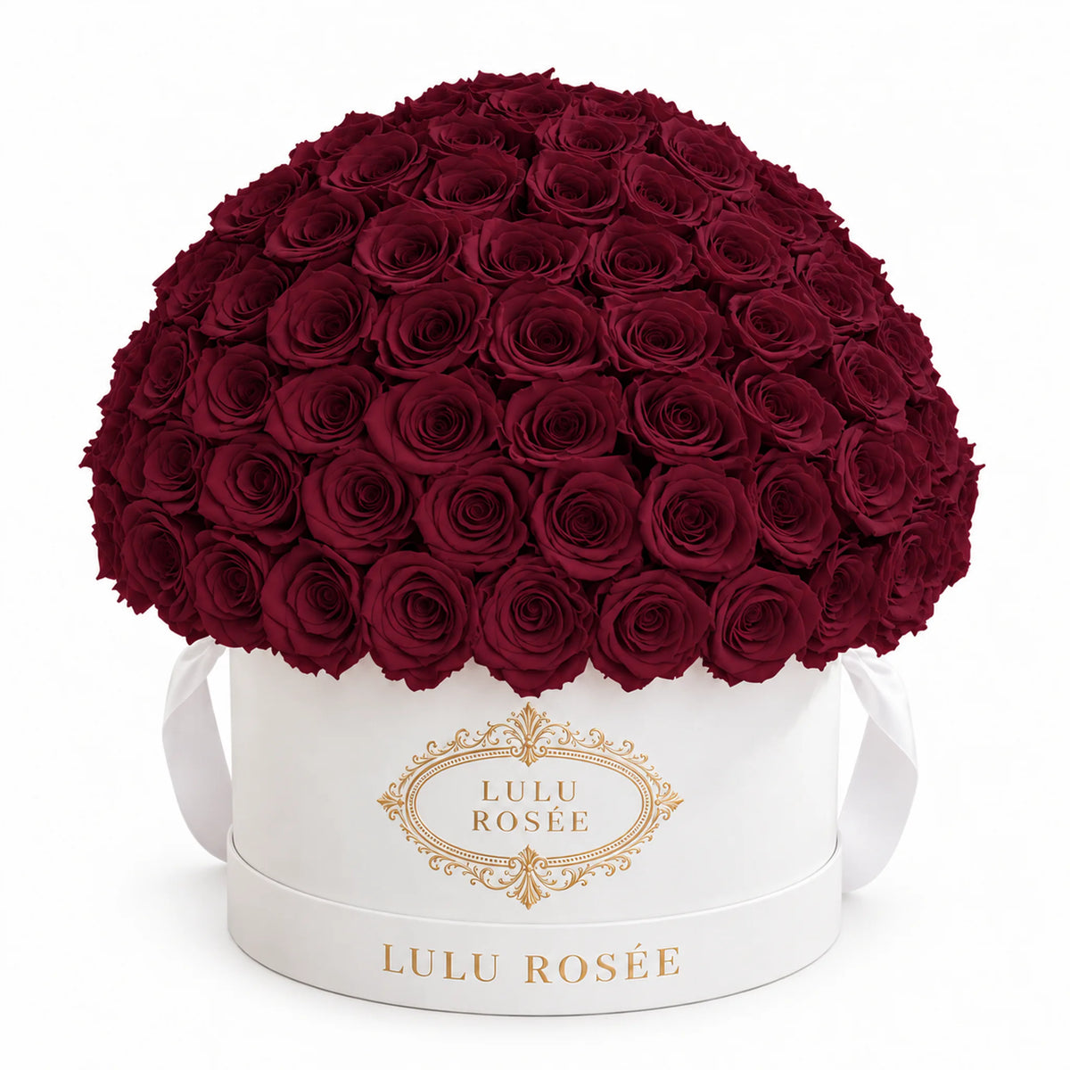 Burgundy preserved roses in a white LULU ROSÉE Large Le Plein box.