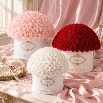 LULU ROSÉE Large Le Plein preserved rose arrangements styled with blush silk in a luxury floral still life.