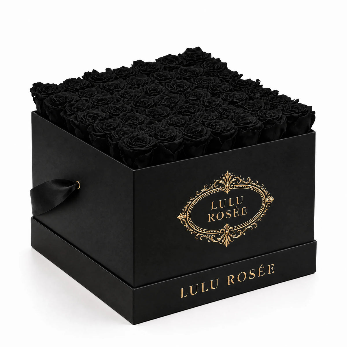 Black preserved roses arranged in a black classic LULU ROSÉE large square box on a white background.