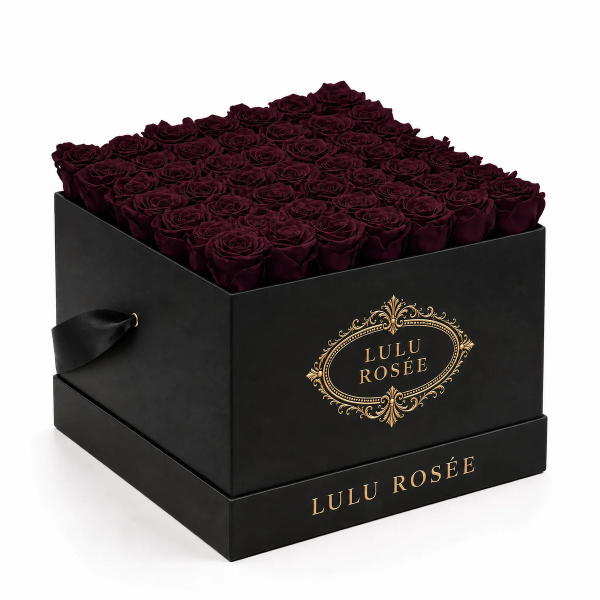 Deep burgundy preserved roses fill a black classic LULU ROSÉE large square box on a white background.
