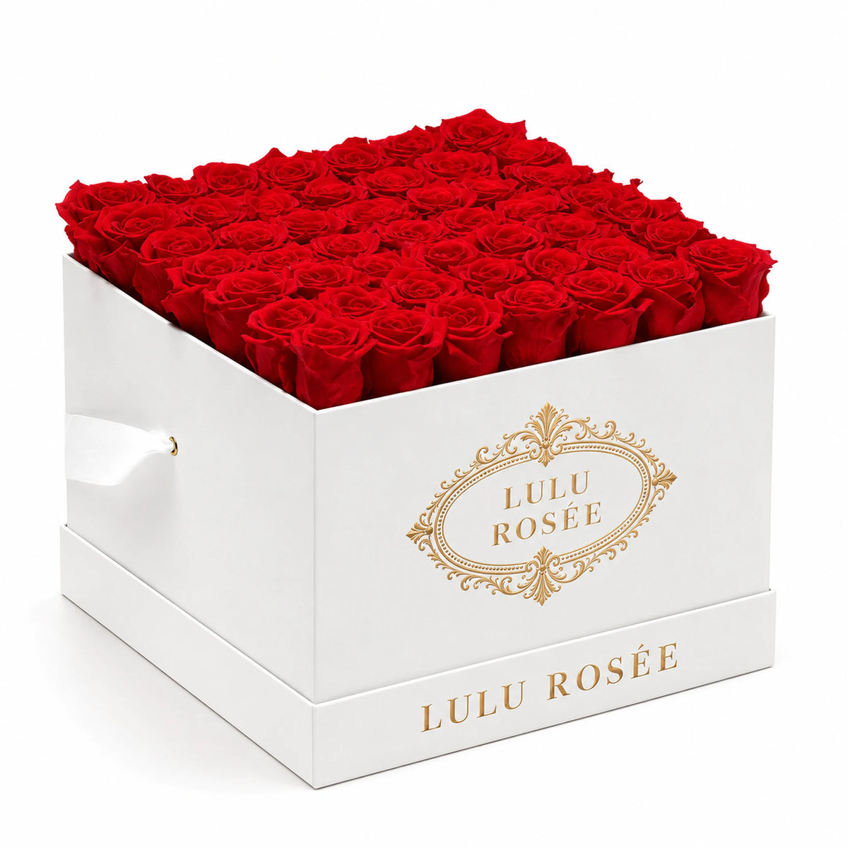 Red preserved roses fill a white classic LULU ROSÉE large square box on a clean white background.