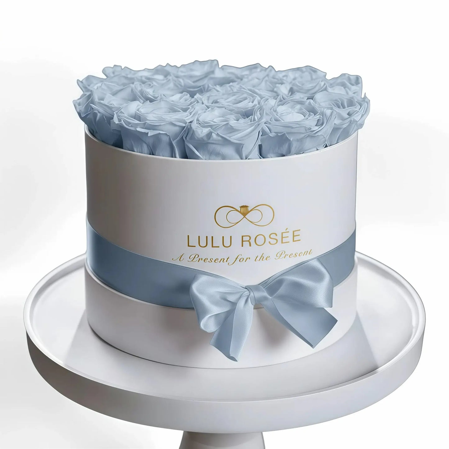 LULU ROSÉE medium round box baby blue roses white classic box on white background