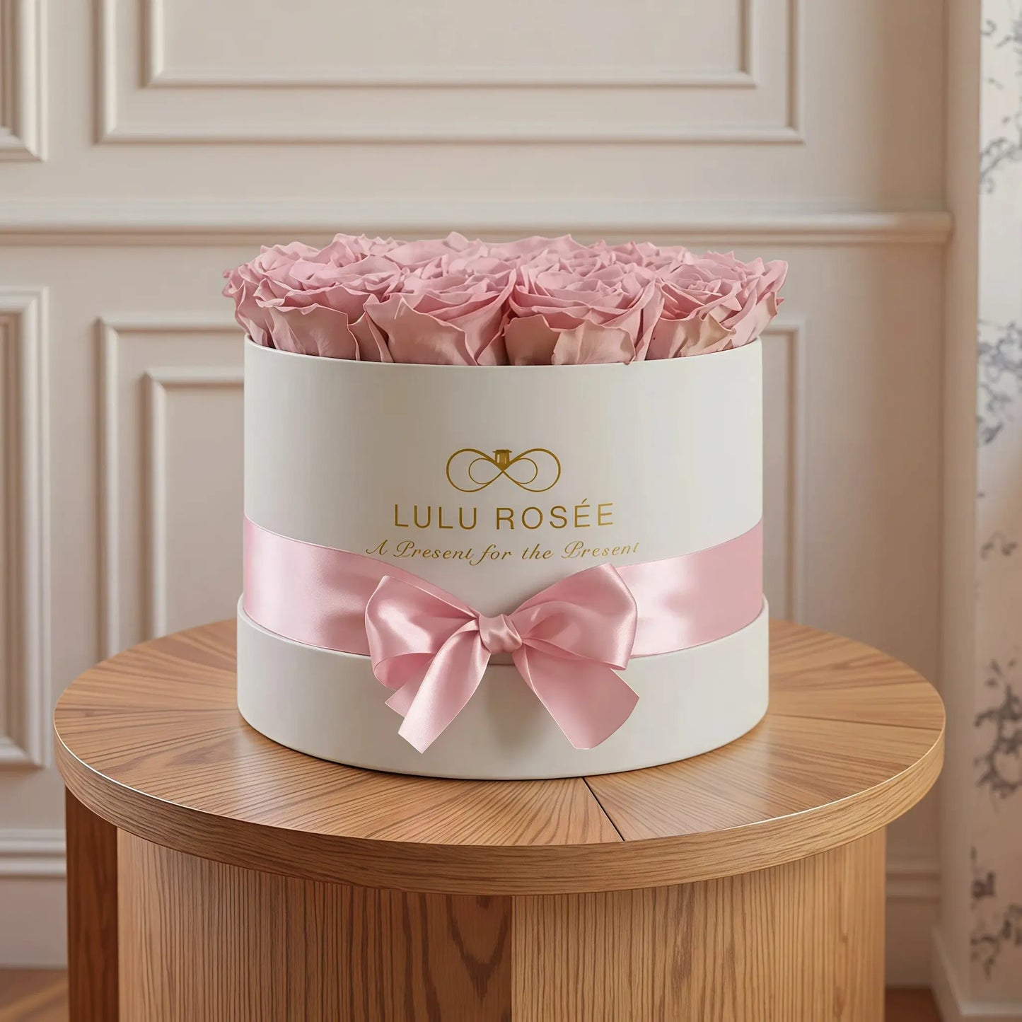 LULU ROSÉE medium round box light pink roses white classic box in a romantic bedroom