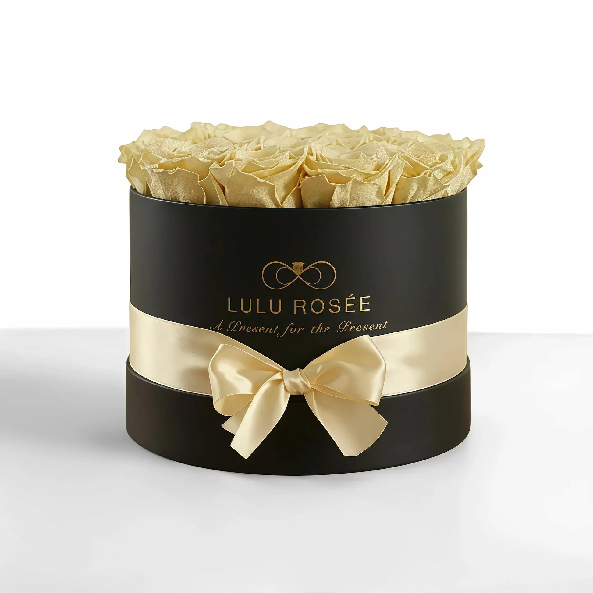 LULU ROSÉE medium round box light yellow roses black classic box on white background
