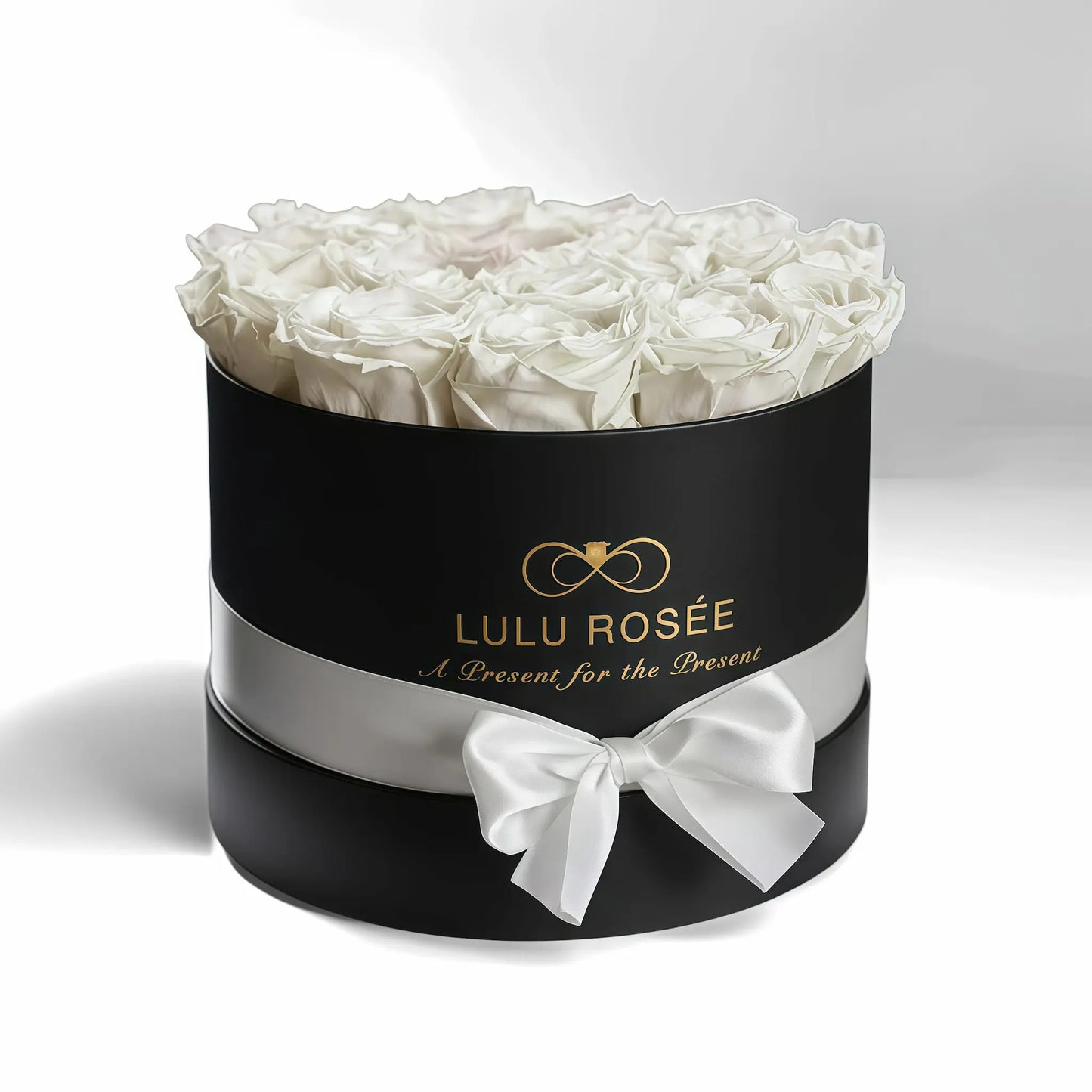 LULU ROSÉE medium round box white roses black classic box on white background