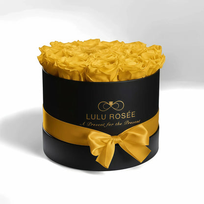 LULU ROSÉE medium round box yellow roses black classic box on white background