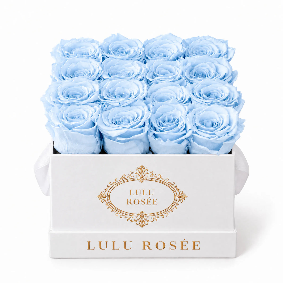 Baby blue preserved roses in a white classic LULU ROSÉE medium square box on a white background.