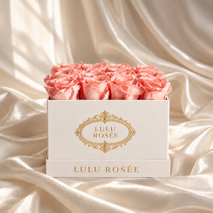 Light pink preserved roses in a luxury LULU ROSÉE medium square box, silk setting.