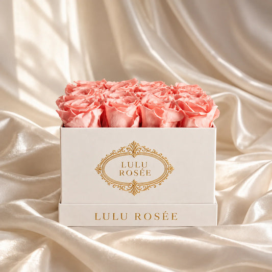 Light pink preserved roses in a luxury LULU ROSÉE medium square box, silk setting.