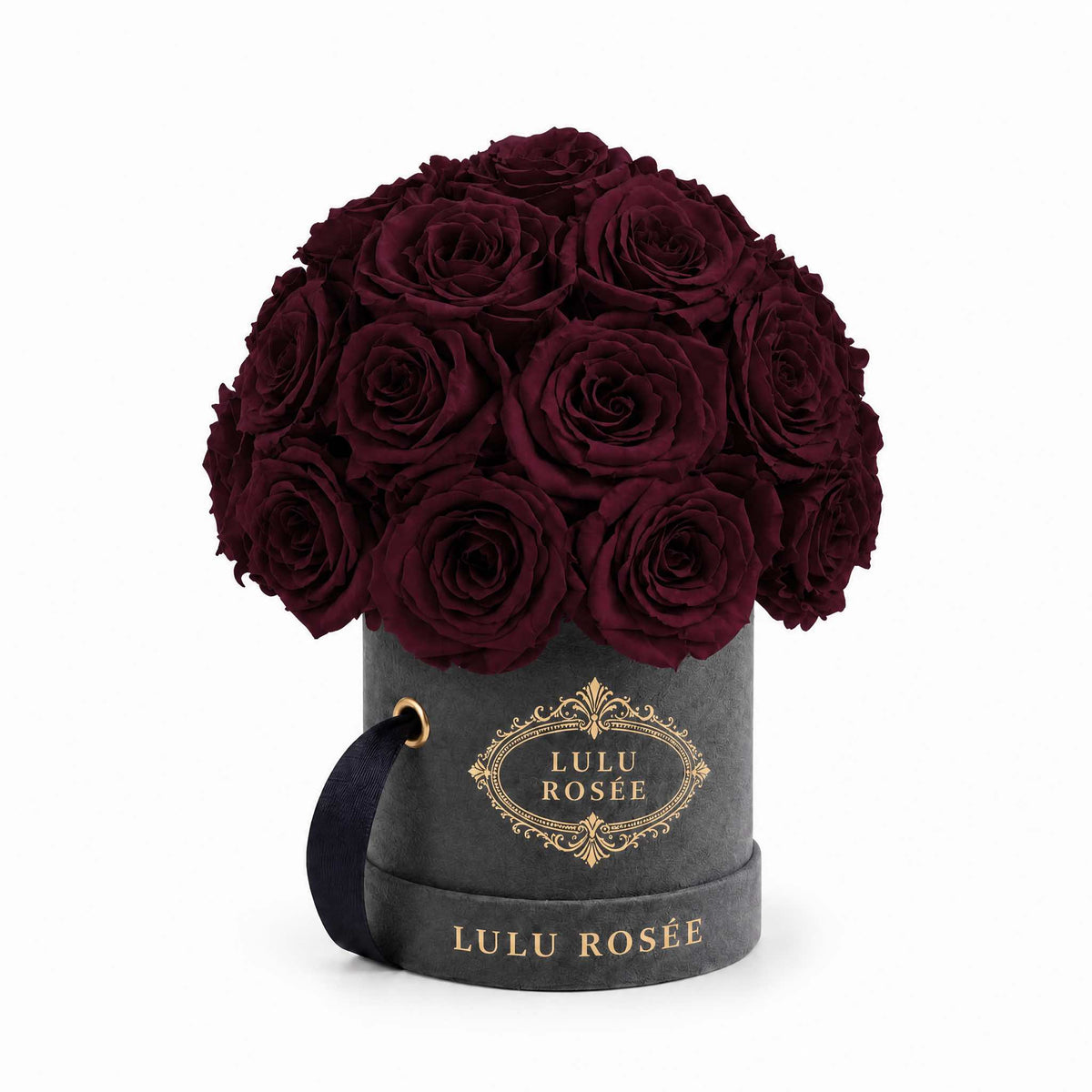 Burgundy eternal roses in a grey suede Mini Le Plein box on a white background.