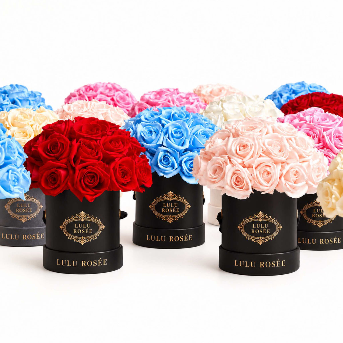 A curated display of LULU ROSÉE Mini Le Plein eternal rose boxes in signature colors and finishes.