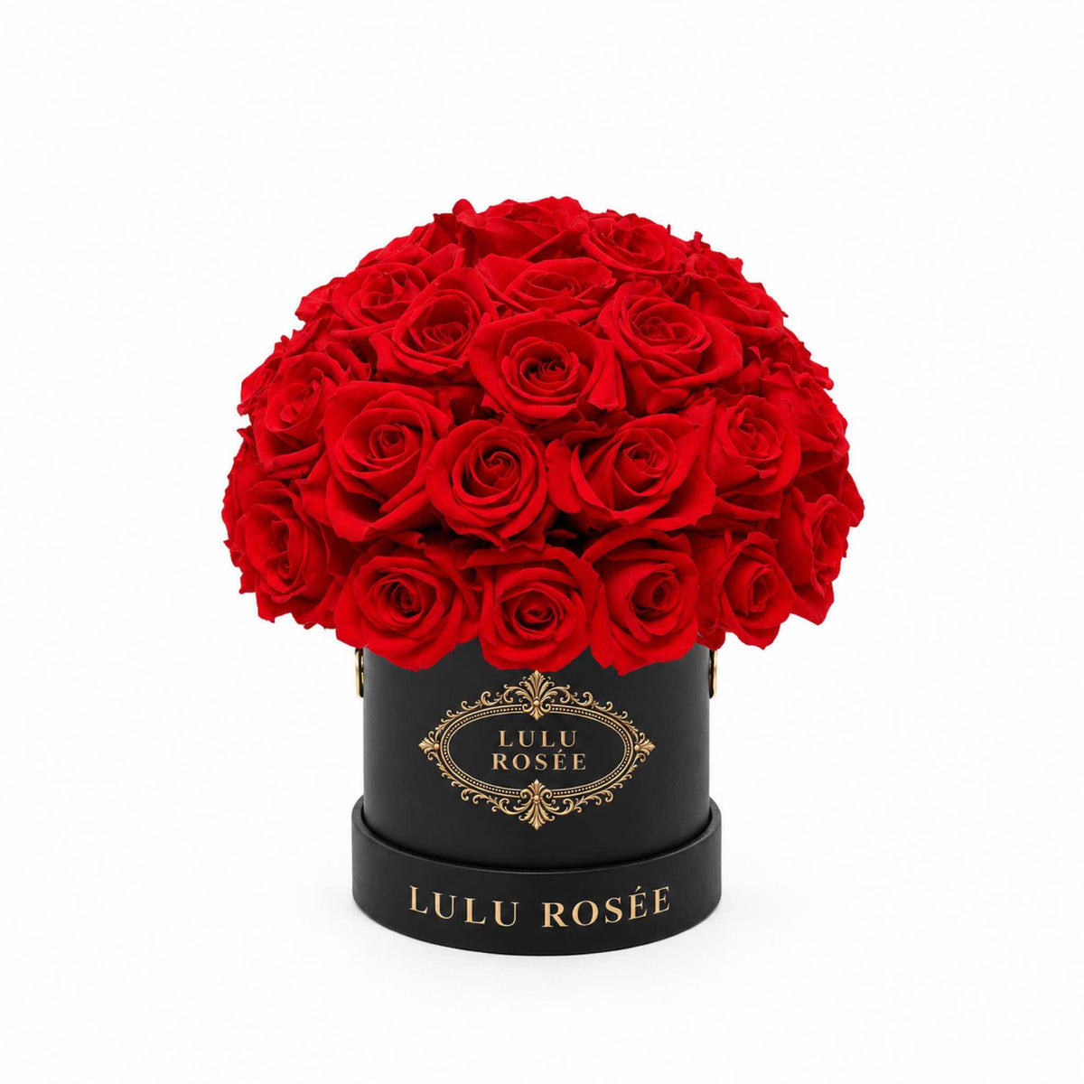Red eternal roses in a grey suede Mini Le Plein box on a white background.