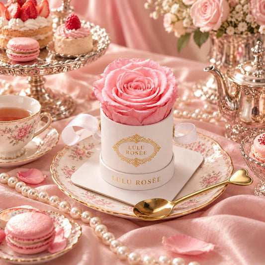 A light pink eternal rose in a white Mini Round box arranged for an elegant afternoon tea.