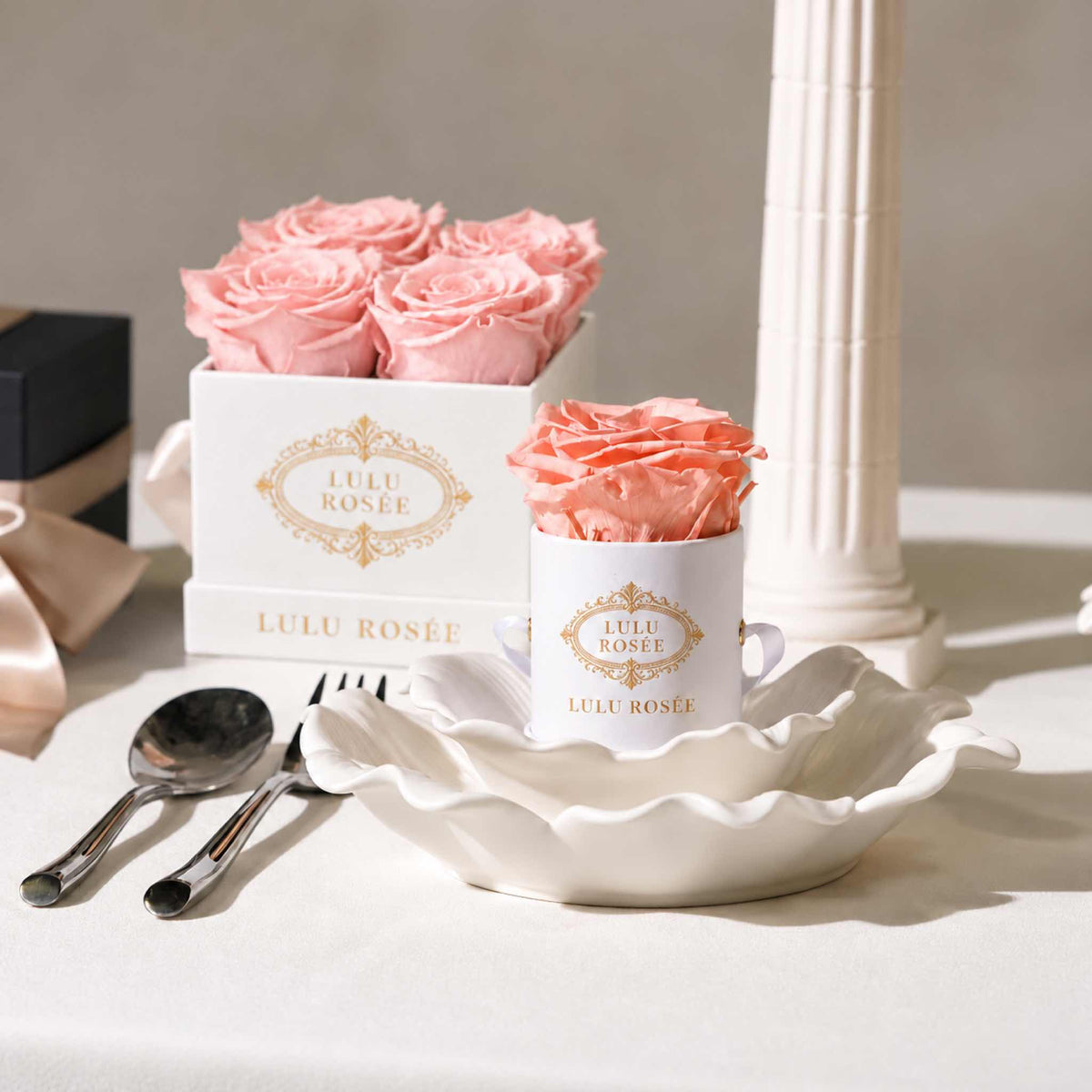 A light pink eternal rose gift displayed with complementary LULU ROSÉE packaging.