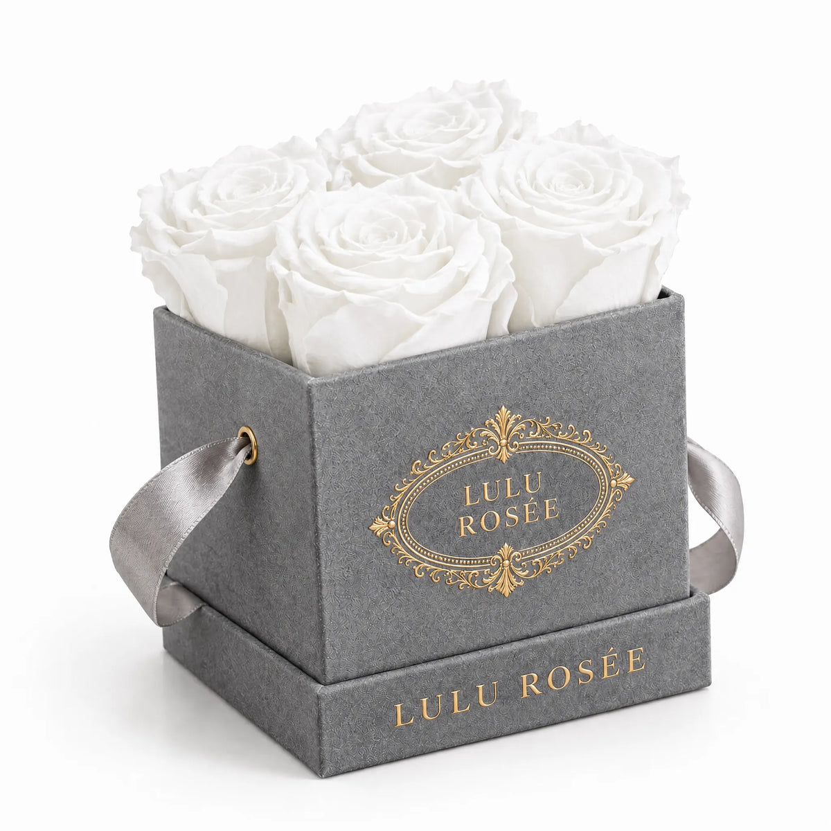 Grey suede box with four white preserved roses, on a white background