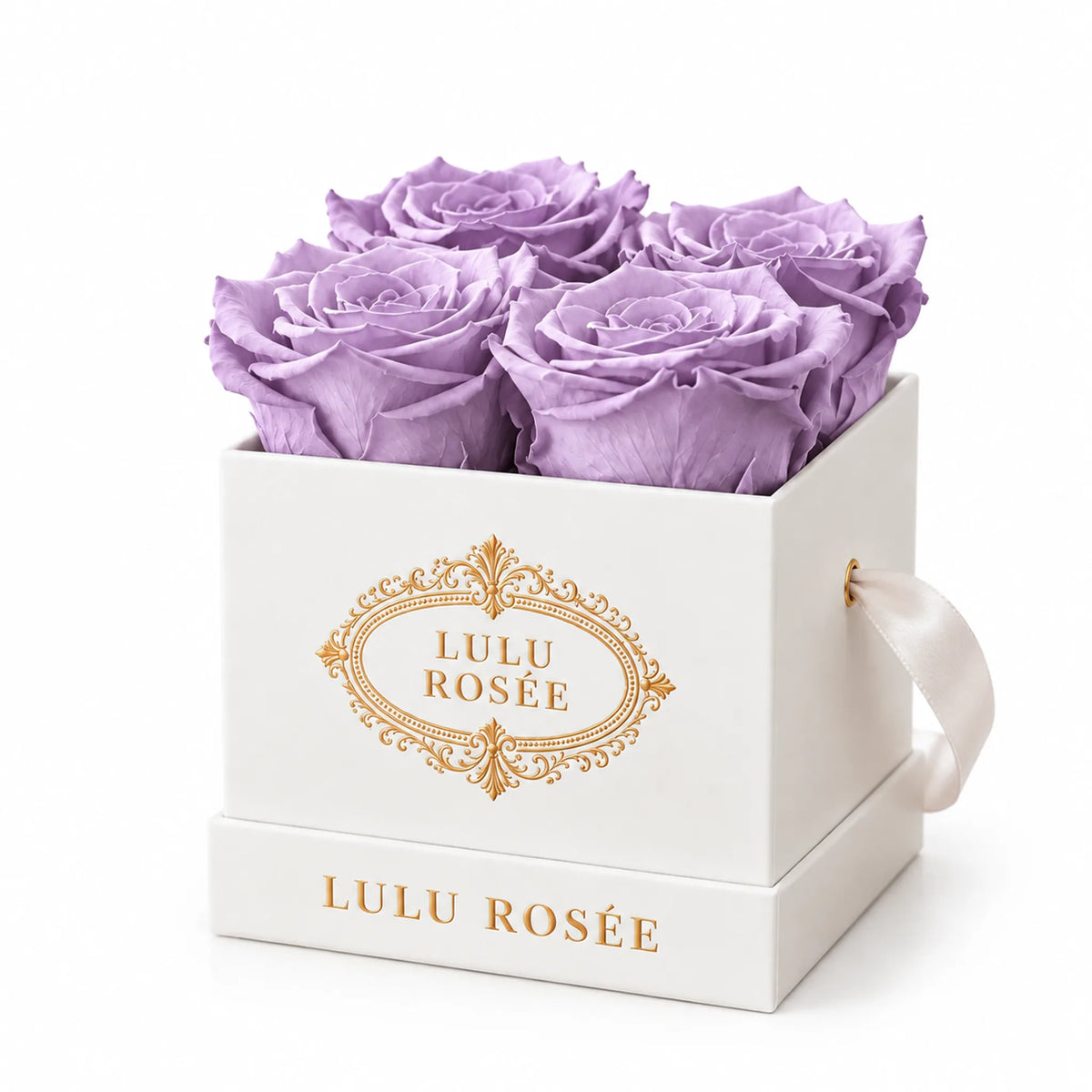 White classic box with four light purple preserved roses, on a white background
