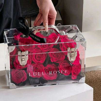 LULU ROSÉE Petite Eternal Acrylic Handbag Rose Box, small transparent acrylic handbag-shaped gift box filled with rosy preserved roses with black silk ribbon, customizable flower color options, mini luxury everlasting floral souvenir for birthday, anniversary & romantic gift giving