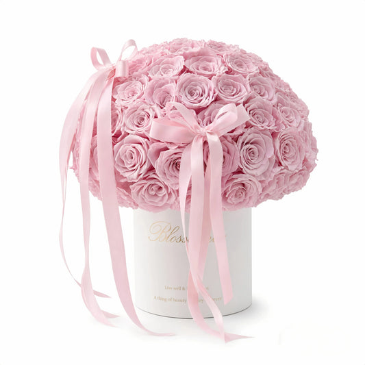 LULU ROSÉE Pink Forever Rose Bucket on Mirror Base, Luxury Preserved Flower Arrangement on a white background