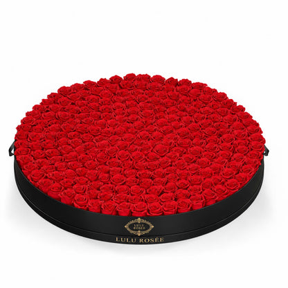 Red eternal roses in a Black Classic grand round rose box
