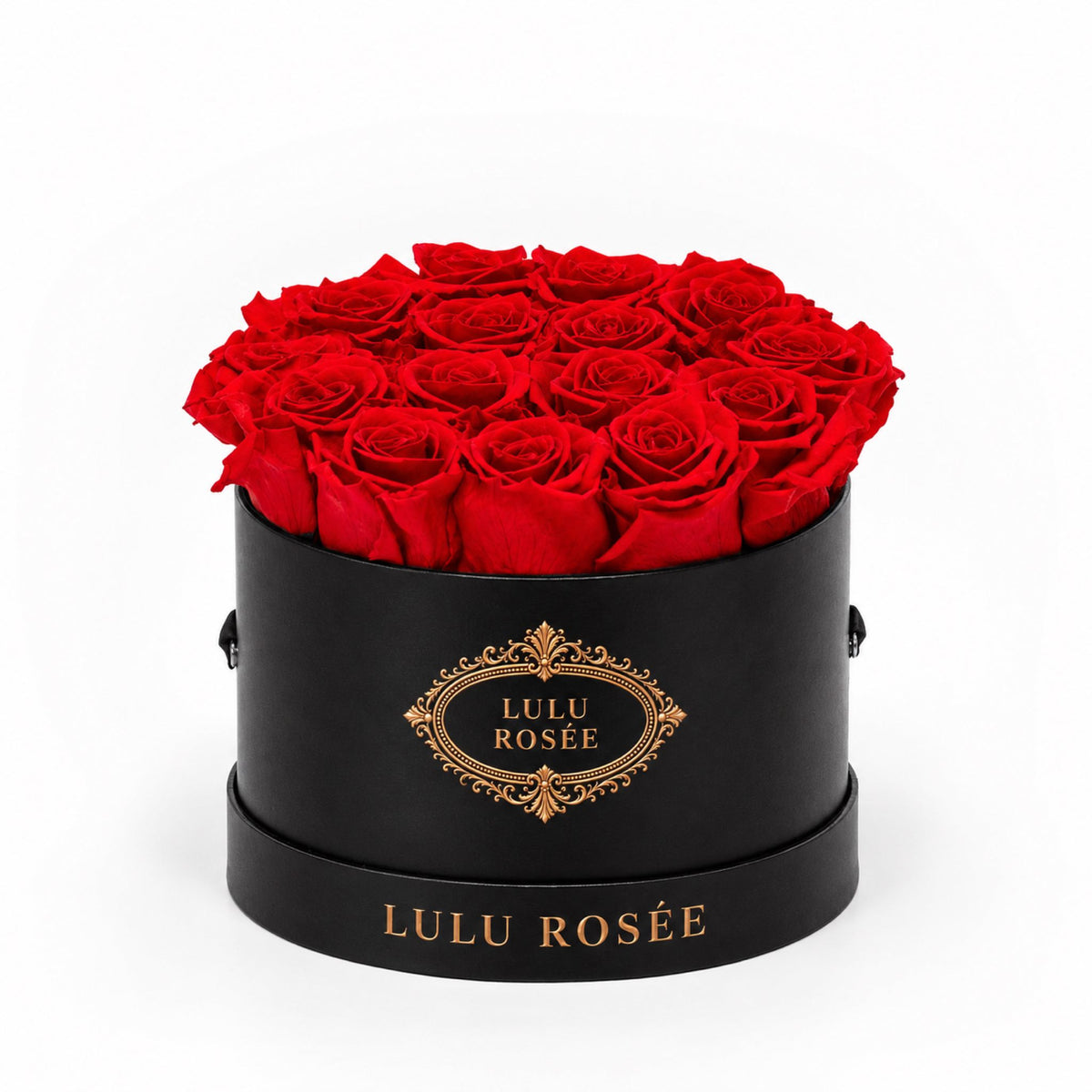 Red preserved roses in a black round box with a gold LULU ROSÉE logo.