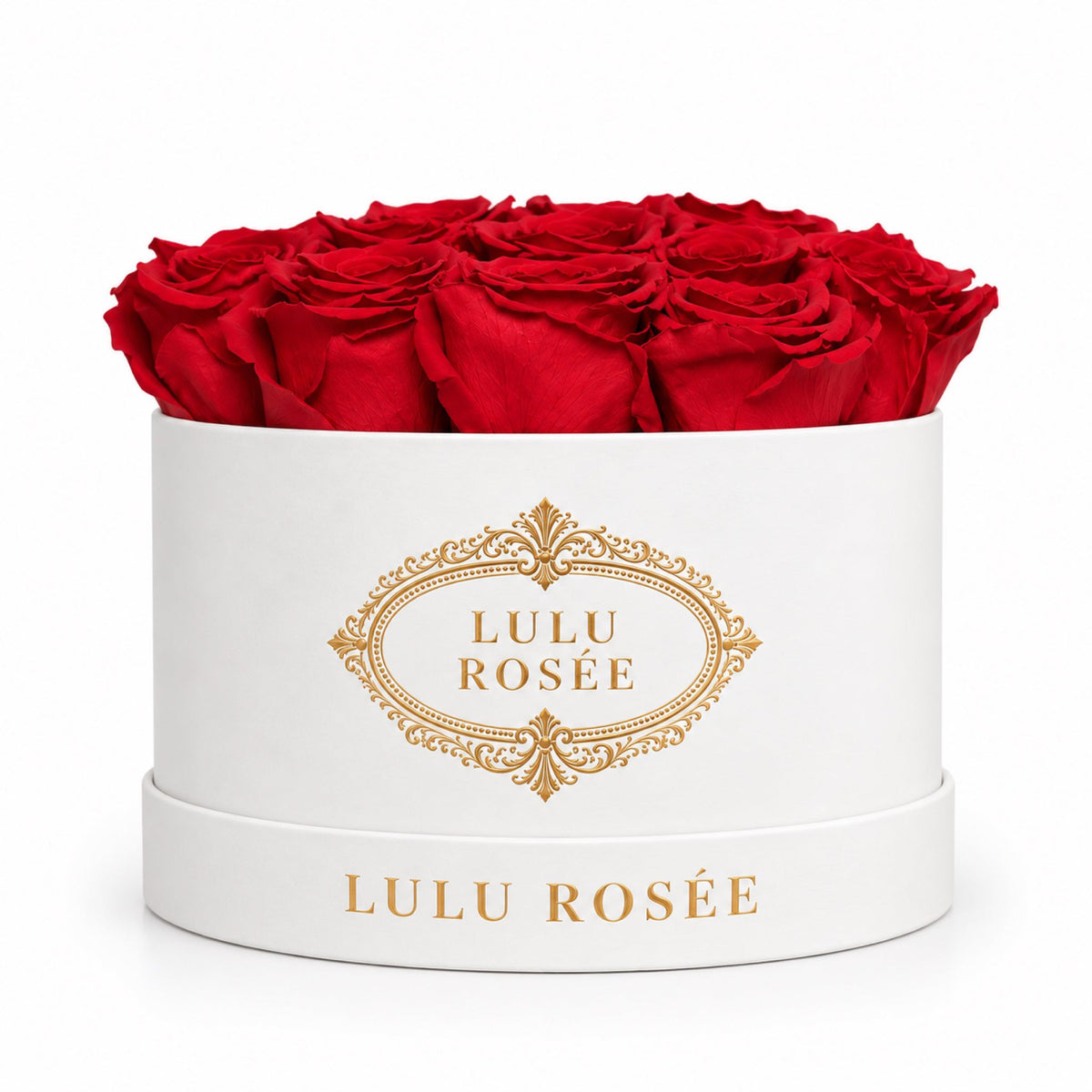 Red preserved roses in a white round box with a gold LULU ROSÉE logo.