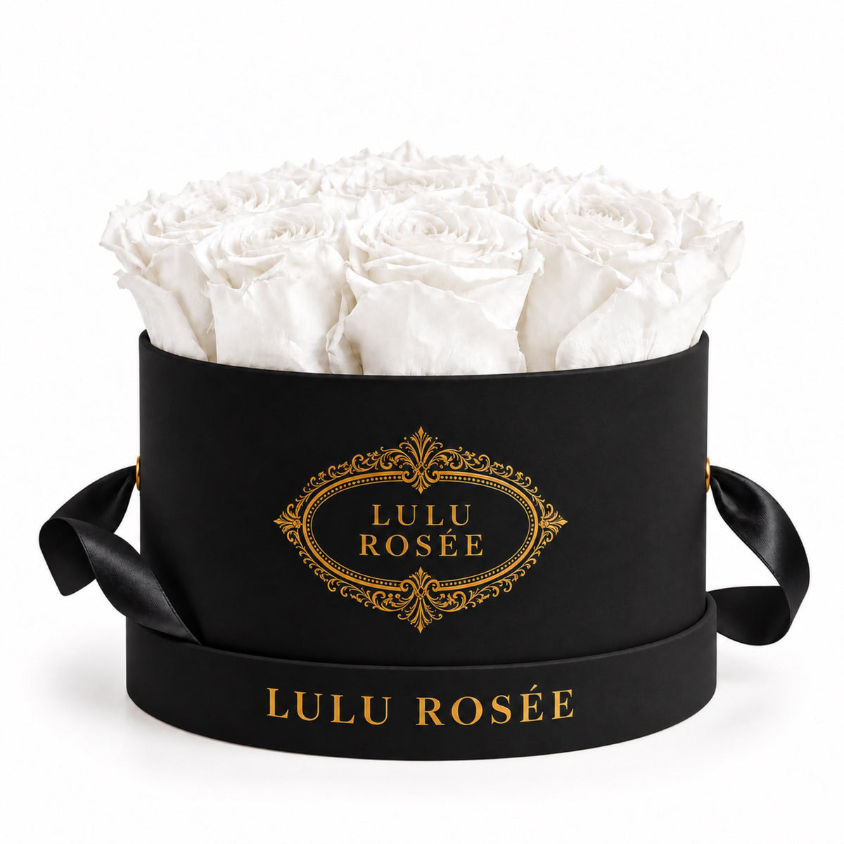 White preserved roses in a black round box, shown in detail.