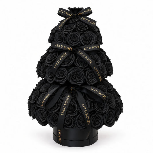 Black preserved rose Christmas tree with LULU ROSÉE ribbons and a round black base