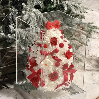 Preserved hydrangea Christmas tree shown in a clear display box with a reflective base.