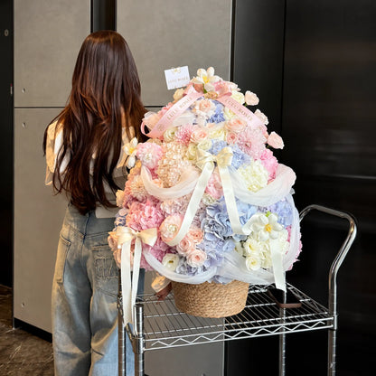 Preserved Christmas flower tree displayed beside a person to show its scale