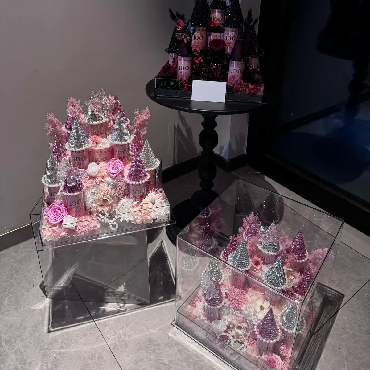 LULU ROSÉE pink and black-pink small preserved flower castles shown together
