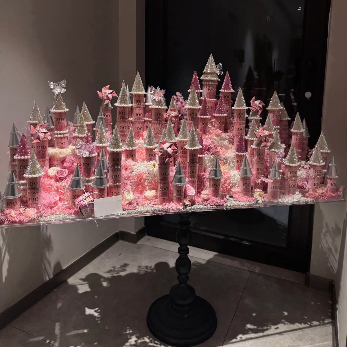 LULU ROSÉE pink giant preserved flower castle shown from an angled view