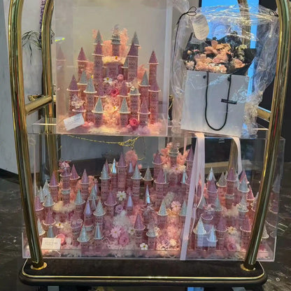 LULU ROSÉE pink giant and medium preserved flower castles shown together