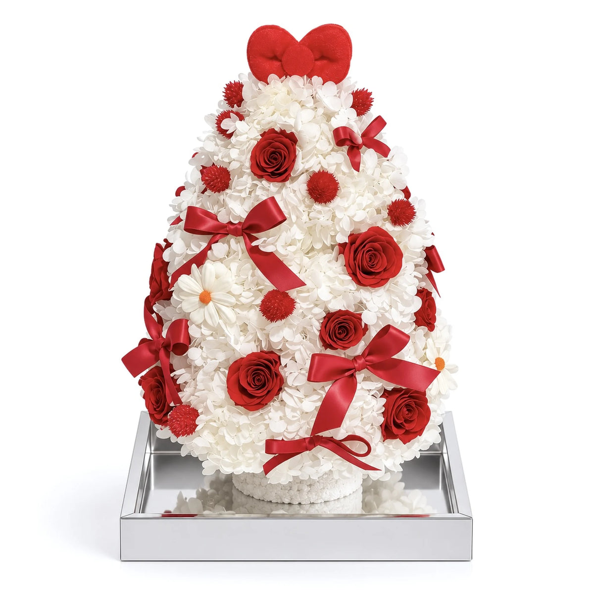 White preserved hydrangea Christmas tree with red roses and ribbon bows on a white background.