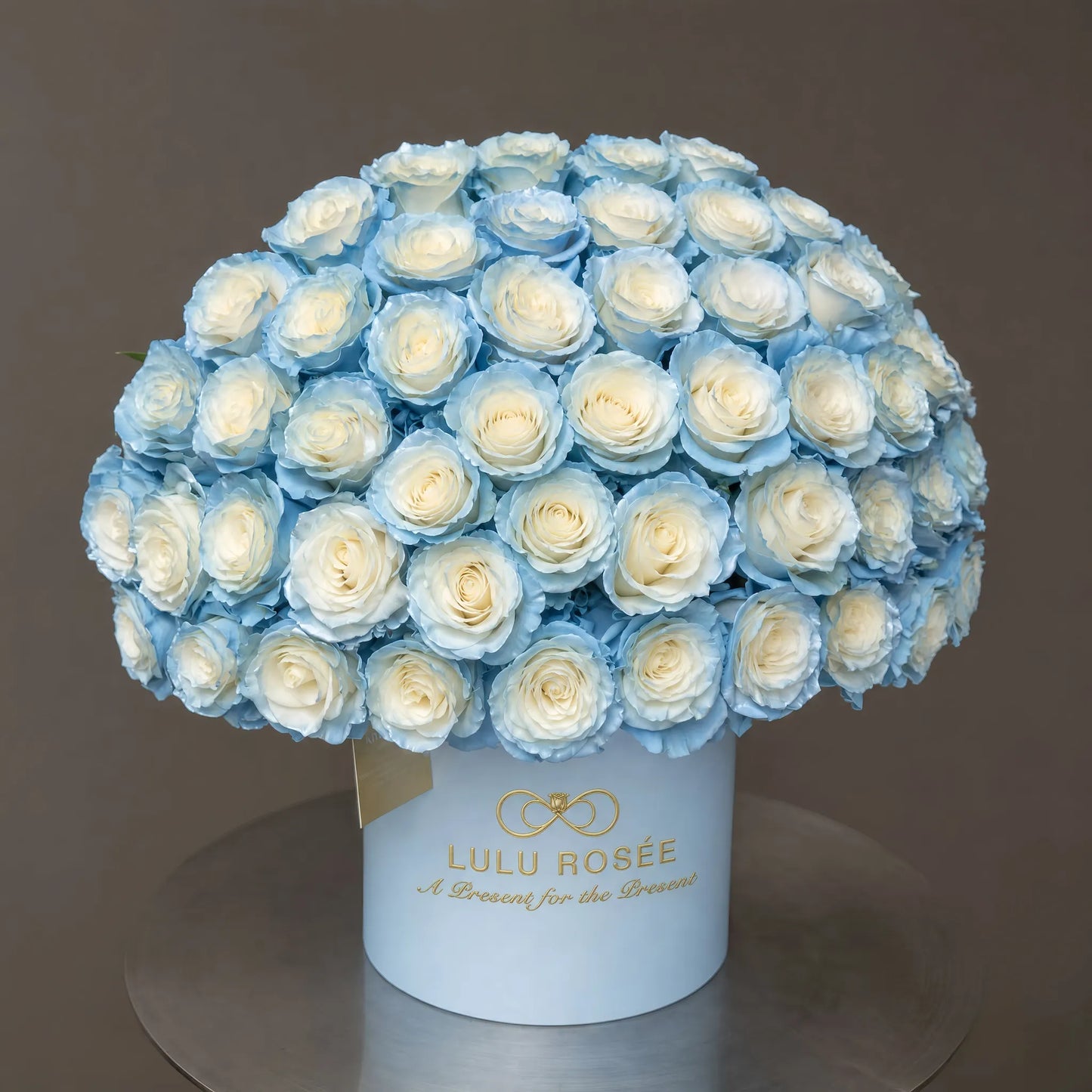 LULU ROSÉE Grande Superdome Ice Blue Gradient Preserved Rose Box profile view, full rounded superdome gradient ice blue preserved roses in light blue round gift box